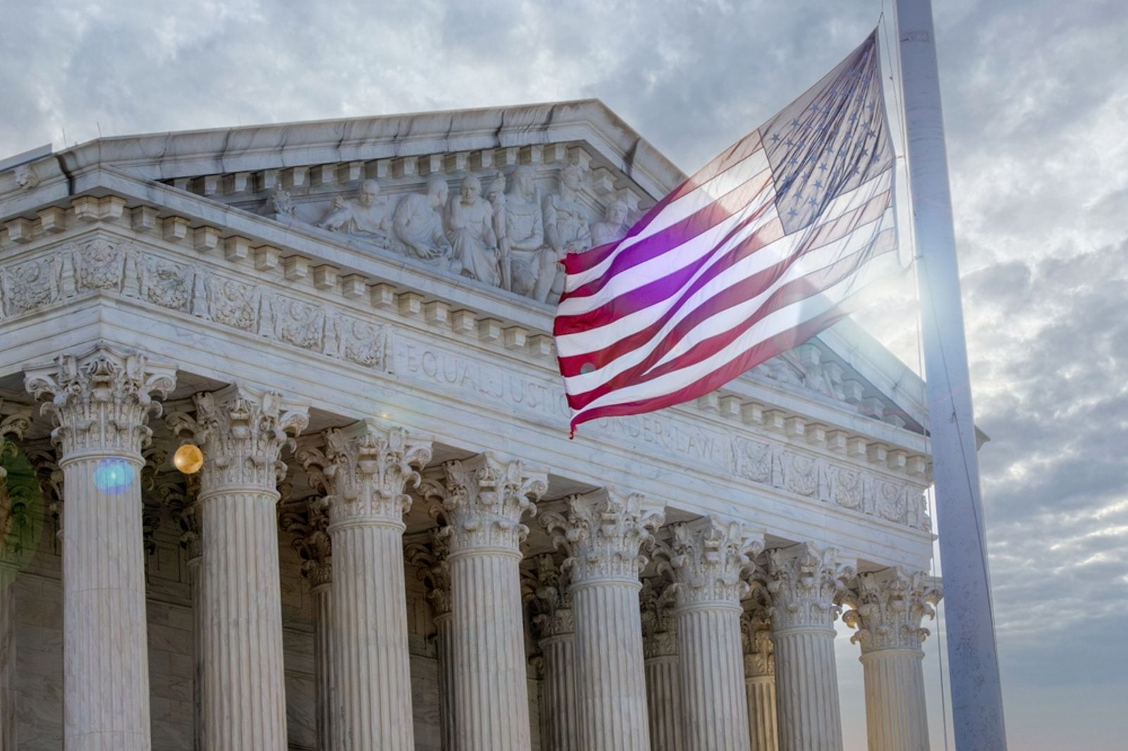 US Supreme Court with American flag — IEEPA tariff decision